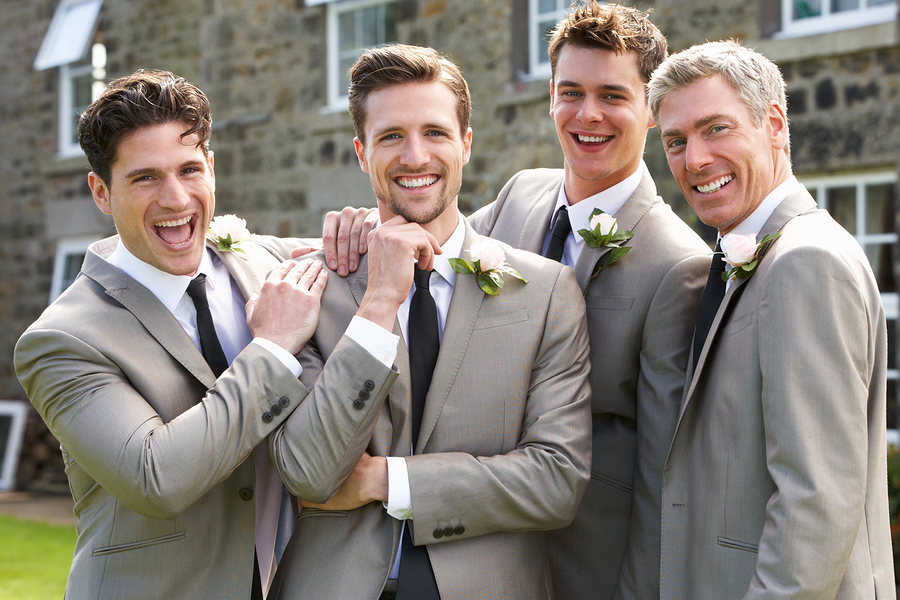The groom, best man and father of the bride in their hired wedding suits.